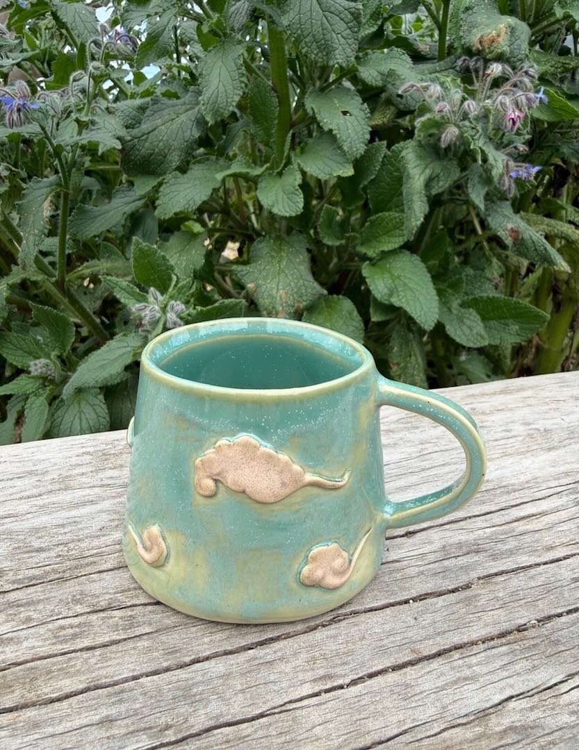 Kumo clouds on a mug.